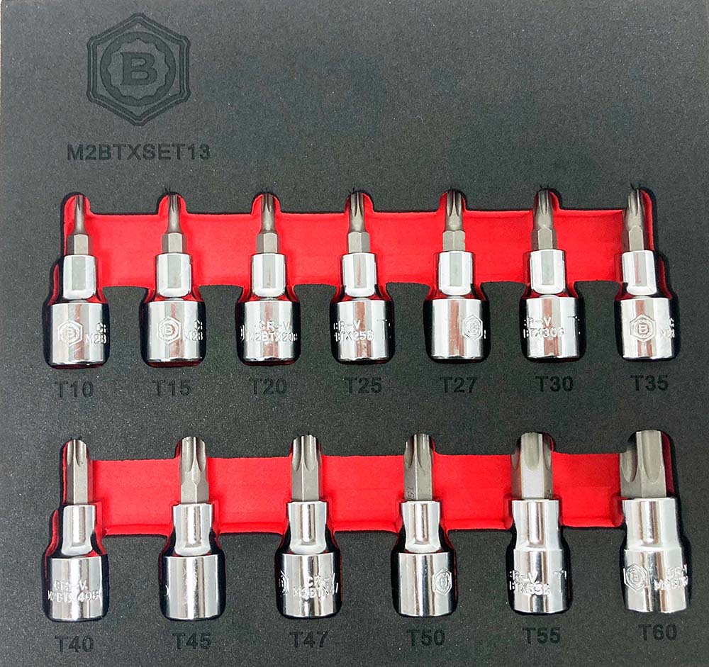 A set of 13 3/8" drive Torx star bit sockets from the Britool Hallmark range, arranged in order from T10 to T60, displayed in red and black foam inserts.