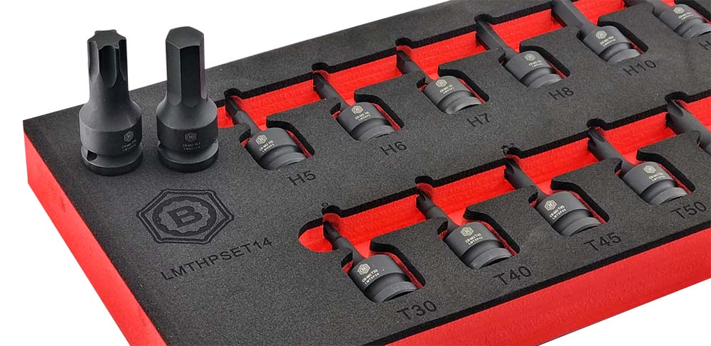 Close up image of the Britool Hallmark 14pc torx and hex impact bit driver set, showing a hex and torx bit on the foam tray set.