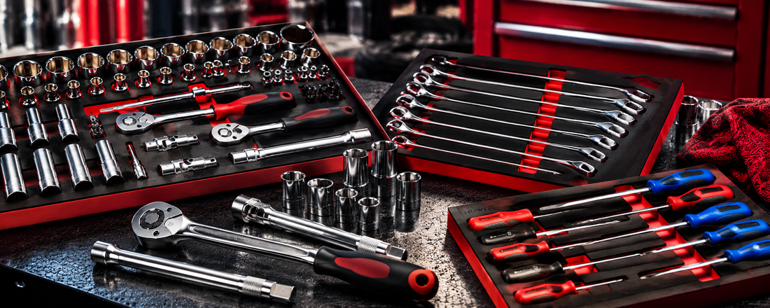 Professional hand tool sets including sockets, ratchets, spanners and screwdrivers in tool control foam trays